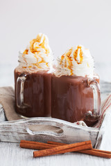 hot chocolate with whipped cream caramel in mason jar