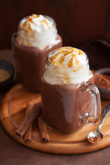 hot chocolate with whipped cream caramel in mason jar