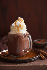 hot chocolate with whipped cream caramel in mason jar