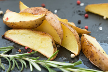 Baked potatoes with rosemary and spices