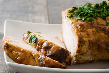 Roasted pork on wooden table

