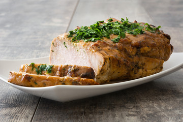 Roasted pork on wooden table
