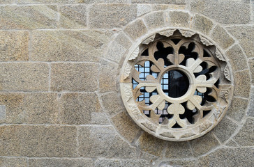 Stone Carved Rose Window in Stone Wall