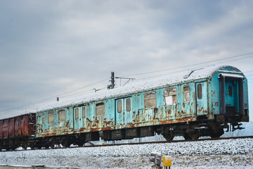 Obraz premium Abandoned train in the snow, colorful and rusty