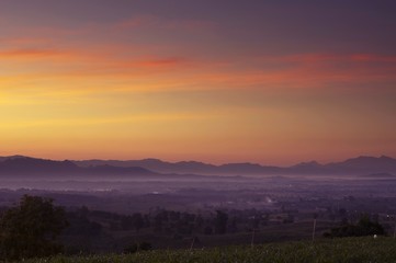 Fototapeta na wymiar Sunset with silhouetted mountains