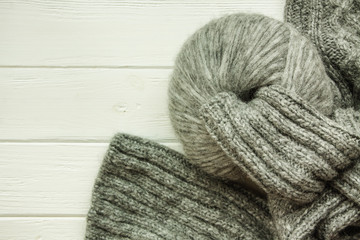 Fototapeta na wymiar Knitting yarn rolled into balls on a white wooden background.