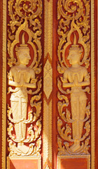 Fototapeta na wymiar Temple door art in buddhist temple