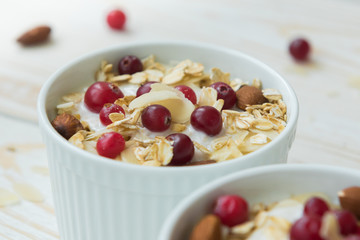 Yogurt with cranberries, almonds, oatmeal, almond flakes