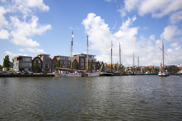 Noorderhaven canal with boats and houses in historic old town of Harlingen, Friesland, Netherlands
