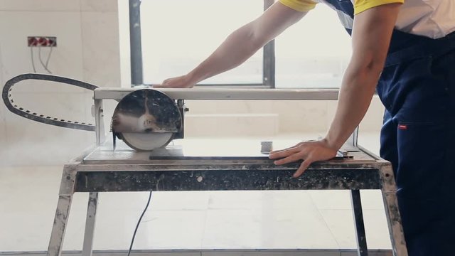 worker and tile cutting machine