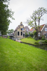 Fototapeta na wymiar view on Dutch village with a canal, The Netherlands