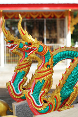 double colorful gold dragon horse statue in Thai temple