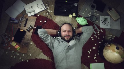 4k Above Science Background of a Man Listening to Music - Powered by Adobe