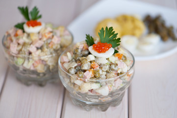 Glass dish with olivier salad, gorizontal shot