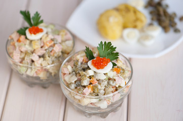 Glass dish with olivier salad, gorizontal shot