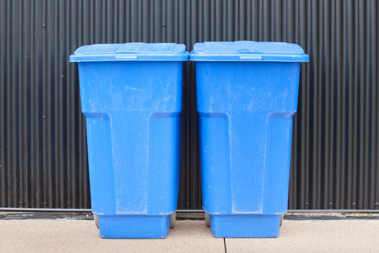 Blue garbage bins. 