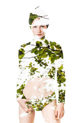 Double exposure of beautiful woman portrait wearing green leaves