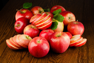 Apple. Fresh red organic fruit on dark wooden background.