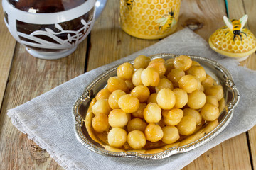 Loukoumades donuts with honey and cinnamon. The concept of celeb