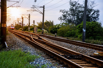 Fototapeta na wymiar Train tracks in the late afternoon sun light.