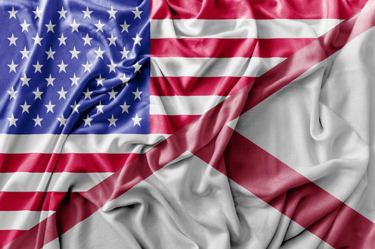 Ruffled waving United States of America and Alabama flag