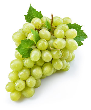 Green grape with leaves. Bunch of fresh berries isolated on whit