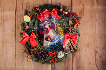 Christmas wreath on wood board. 