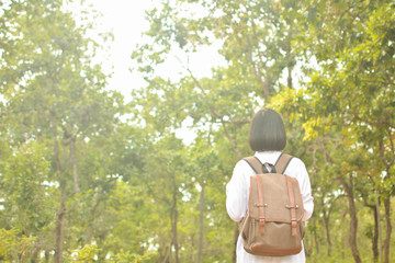 Asian women in nature and relax time on holiday.concept travel color of vintage tone 