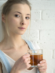 young caucasian woman drinking tea