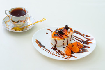 fruitcake with chocolate and orange and a cup of tea