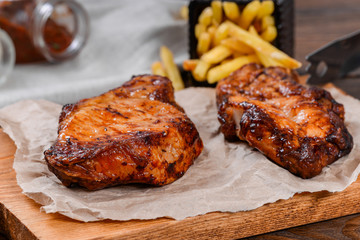 Two piece of meat cooked on the grill