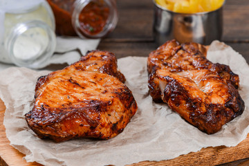 Two piece of meat cooked on the grill