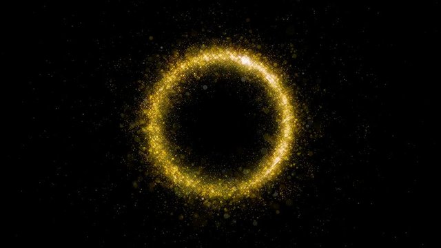 Gold glittering star dust circle of trail sparkling particles on black background. Magic golden flying particles.