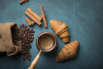Cup of coffee with brown sugar on a wooden table