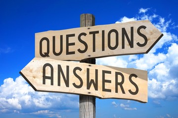 Questions, answers - wooden signpost
