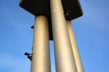 Zizkov television tower, Prague, Czech Republic / Czechia - modern communications tower and transmitter of signal, futuristic landmark of the city. Statues of crawling babies on surface of building