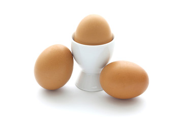 close up egg with egg cup isolated on white background