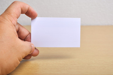 Hand hold blank mockup business card for branding and logo printing.