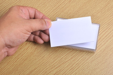 Hand hold blank mockup business card for branding and logo printing.
