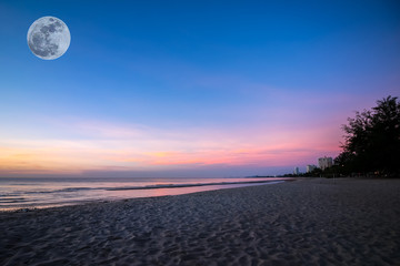 beautiful sunset sunrise background on the beach with super moon