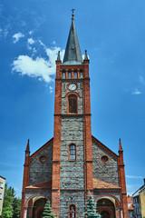 Fototapeta na wymiar Rural parish church with bell tower in Poland.