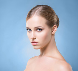 Portrait of a young blond woman in light makeup