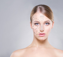 Portrait of a blond woman with arrows on her face © Acronym