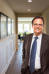 Fototapeta premium Smiling Businessman In Hallway of New House.