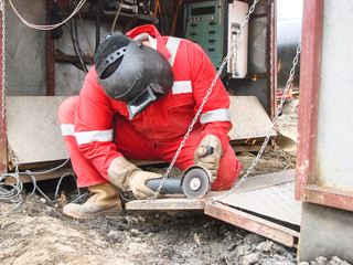 Safety at work. Welding and grinding of iron constructions. Industrial weekdays welders and fitters