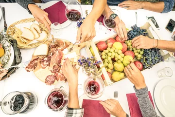 Fotobehang Top view of friend hands eating food and wine at barbecue garden party - People group enjoying fruit and sliced sausages at backyard meeting - Lunch and dinner concept outdoors - Bright vivid filter © Mirko Vitali