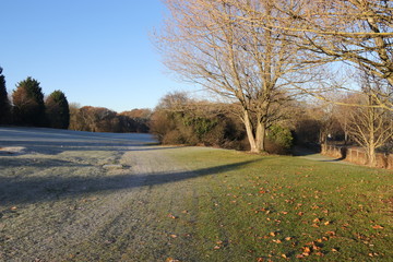 Frost on the fairways greens of a golf course during early morning