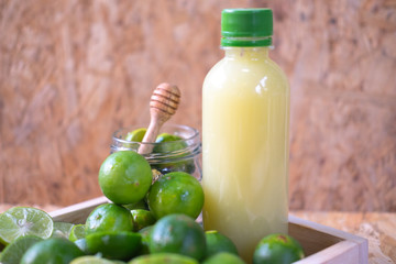 Fresh lime and lemon lemonade in plastic bottle