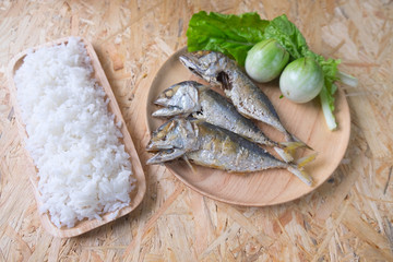 fried mackerel eating with rice