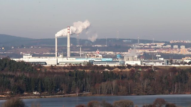 Modern combined heat and power plant. Fuming chimney with sulphur removal unit. Co2 source and climate change theme. Power and fuel generation in Czech Republic, European Union.